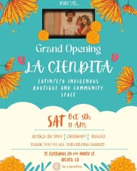 The grand opening flyer with a small photo of the owners and their toddler.